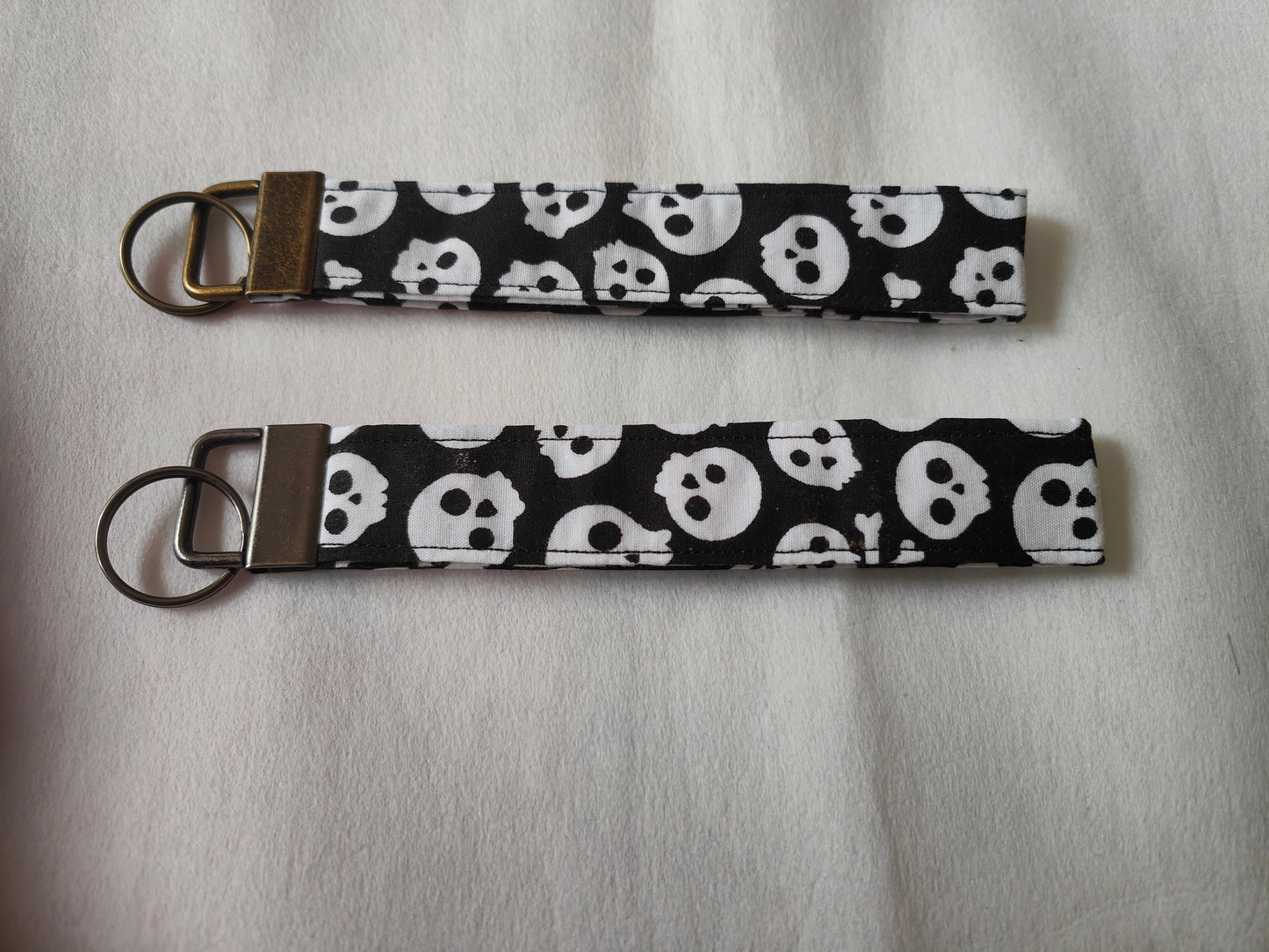 Black skulls wristlet